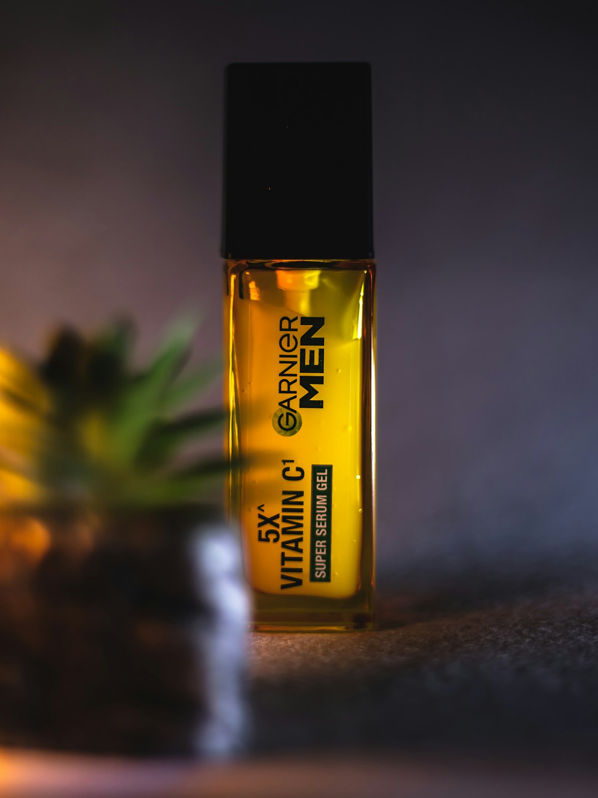Product bottle with plant, studio shot